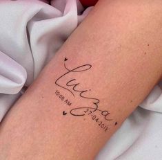 a woman's arm with a tattoo that reads, love is in the air