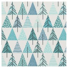 a blue christmas tree pattern with white and green trees on the bottom, in front of a