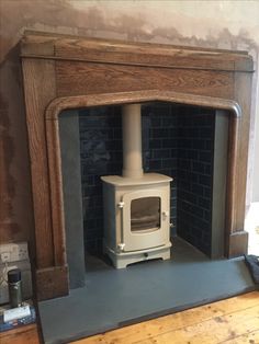 a fireplace with a wood burning stove in it