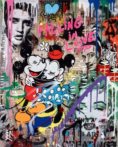 a wall covered in lots of grafitti and spray paint with mickey mouse on it