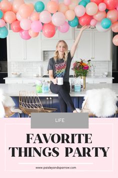 a woman standing in front of balloons with the words life favorite things party