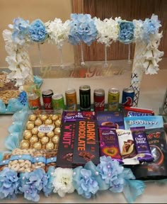 a table topped with lots of food and candy