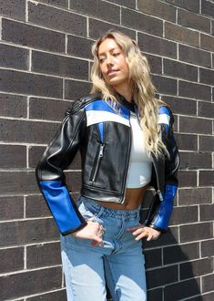 OMG, you are going to be obsessed with this leather racer jacket! The press stud collar detailing and white and blue panel detailing make this jacket so elevated. We would definitely pair this with our favorite pair of jeans or throw it over any outfit as more of a jacket! Model Info Meet Belen! Here she is wearing a size small. Hips: 36.5” | Waist: 26” | Bust: 33” | Height: 5’11” The Details Vegan Leather, Racer Jacket White and Blue Panel Detailing Press Stud Collar Front Zip Cuff and Pocket Z Racer Jacket Women, Outfit With Racer Jacket, Blue Biker Jacket Outfit, Bike Jacket Outfit, Leather Racer Jacket Outfit, Motorcycle Jacket Outfits For Women, Racer Girl Outfit, Blue Leather Outfit, Blue Racer Jacket