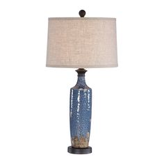 a blue table lamp with a white shade