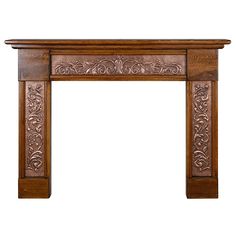 an ornate wooden fireplace mantel with carvings on the top and sides, isolated against a white background