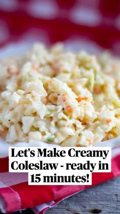 a white bowl filled with coleslaw on top of a red and white checkered cloth