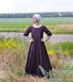 Check out this item in my Etsy shop https://www.etsy.com/listing/1031479518/medieval-long-woolen-cotehardie-14th Regency Style Long Sleeve Medieval Dress For Festivals, Medieval Dresses With Historical Design For Fall, Regency Style Medieval Dress For Larp And Festivals, Medieval Overdress, Kirtle Dress, Medieval Gown, Medieval Garb, Low Neckline, Wool Clothing