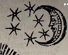 an image of the moon and stars drawn on paper