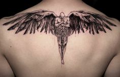 an angel tattoo on the back of a man