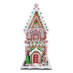 a large gingerbread house with candy canes on it