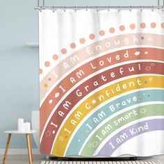 a rainbow shower curtain with the words i am enough to be loved