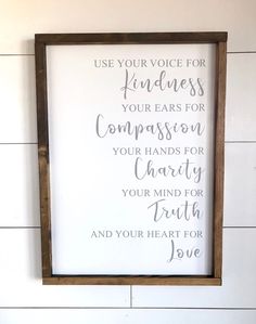 a framed sign with the words use your voice for happiness