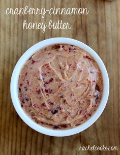 a white bowl filled with cranberry cinnamon honey butter