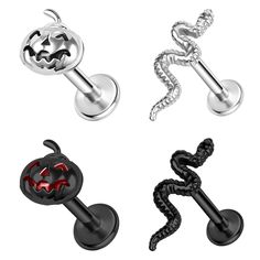 four different types of piercings with red and black designs on them, including an ear plug