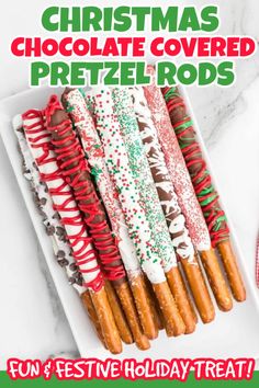 christmas chocolate covered pretzel rods on a white plate