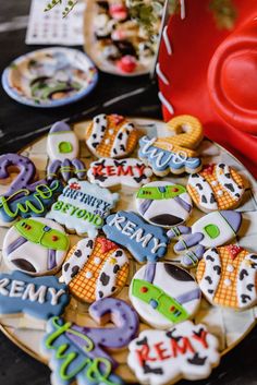 decorated cookies are sitting on a plate