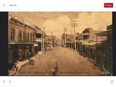 an old photo of a city street with buildings