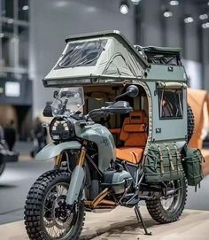 a motorcycle with a tent attached to the back