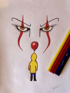 a drawing of a clown's face with a red balloon in front of it