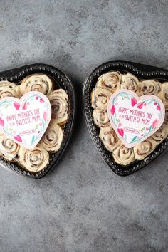 two heart shaped pastries sitting next to each other