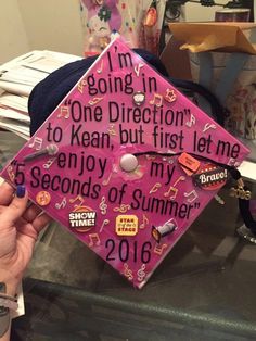 a pink graduation cap with writing on it that says, i'm going in one direction to mean, but first let me 3 seconds of summer