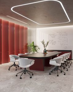 a conference room with white chairs and a large table in the center, along with a chalkboard on the wall