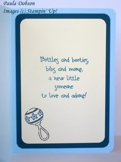 a blue and white greeting card with an image of a baby's pacifier