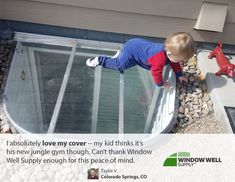 a little boy standing on top of a glass enclosure