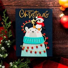 a christmas card with an image of a polar bear and penguin