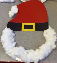 a santa hat made out of cotton on top of a table