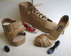 there are two pairs of shoes made out of cardboard