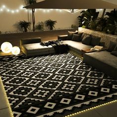 a large black and white rug with lights on it