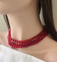 Gorgeous 3 Strand Red Jade Necklace Top Quality translucent  Stones Silver Colored Alloy Snap Lock closure  Knotted between each Stone  Special Occasion Necklace . Stunning/Trendy/Unique/stylish Wear. Complements most color outfits  Green Jade : 8-9 mm Necklace Length : 17 -20 inches Elegant Beaded Necklaces For Valentine's Day, Valentine's Day Elegant Beaded Necklaces, Red Round Beads For Formal Occasions, Red 8mm Beaded Jewelry For Valentine's Day, Elegant Red Choker With Round Beads, Red Pearl Necklace With Gemstone Beads, Formal Red Round Beads, Red Jade Necklace, Classic Red Faceted Necklaces