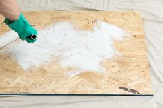 How to Paint OSB Board How To Paint Osb Board, Osb Kitchen Ideas, How To Cover Osb Board, Chip Board Walls, Paint Osb Walls, Osb Board Walls, Painting Osb Walls Ideas, Osb Walls Ideas, Stair Landing Ideas