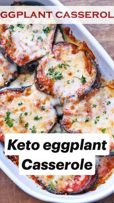 eggplant casserole with cheese and parsley in a white dish on a wooden table