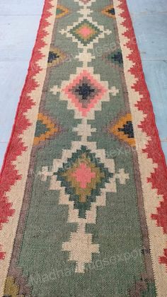 an old rug is laying on the floor