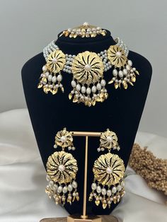 traditional punjabi pattra choker tikka set .  It's lightweight but heavy look.   Tikka width- 1.5 inches  Earrings length- 2.2 inches approximately  Style tip- ----------- Pair it with any beautiful traditional outfits  and flaunt with Unique style of collection from us. Perfect match for Festival and Traditional wear.  Take Care Tips-  ---------------- Kee away from perfume, Hair spray and. Moisture.  Store in dry place , Ziplock bag or Airtight box.    Clean with dry cloth.  Jewellery is the Gold Bollywood Style Handmade Tikka, Handmade Kundan Gold Sets, Handmade Kundan Gold Jewelry Set, Handmade Gold Kundan Set, Handmade Gold Kundan Jewelry Set, Gold Kundan Sets With Dabka Detailing, Handmade Gold Kundan Tikka, Festive Handmade Gold Sets, Jadau Set