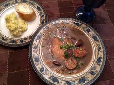 two plates filled with food on top of a table