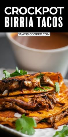 crockpot burrito tacos on a white plate with cilantro garnish