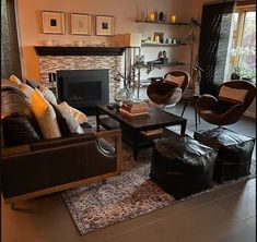 a living room filled with furniture and a fire place