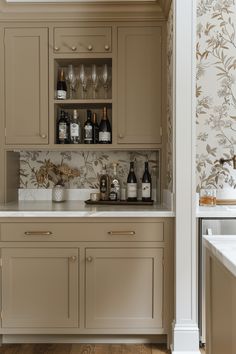 a kitchen filled with lots of bottles and glasses