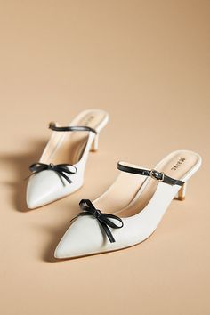 Leather upper, insole Rubber sole Plastic kitten heel Slip-on styling Imported | Bow Kitten-Heel Mules by Maeve in White, Women's, Size: 8 at Anthropologie Bow Mules, Stunning Shoes, Heel Mules, White Heels, Shoe Closet, Dream Shoes, Kitten Heel, Black Bow, Mules Shoes