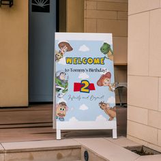 a welcome sign for two years old with cartoon characters on it and the number 2