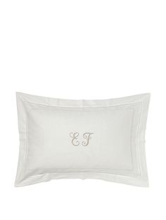 the embroidered monogrammed pillow is shown in white and has an initial on it