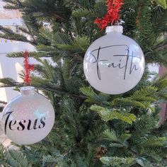 two ornaments that say faith and jesus on them