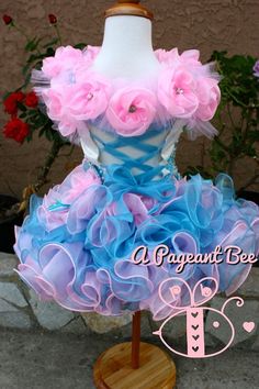 a mannequin with pink and blue flowers on it