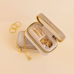 Introducing our Mini Travel Jewelry Box, the ultimate companion for your globetrotting adventures. Compact yet spacious, this travel box ensures you can carry all your jewelry essentials in style wherever life takes you. With its sturdy build and velvety exterior, you can jet-set with ease, knowing your favorite accessories are tucked away in this chic travel buddy ♡ Featuring a ~3.25 x 2 inch jewelry case with a zipper closure Made of soft velvet in the color Beige Part of our Charms & Extras C Initial Tag Necklace, Sideways Initial Necklace, Dainty Initial Necklace, Travel Buddy, Jewelry Holders, Jewelry Travel, Travel Jewelry Box, Travel Box, Leather Box