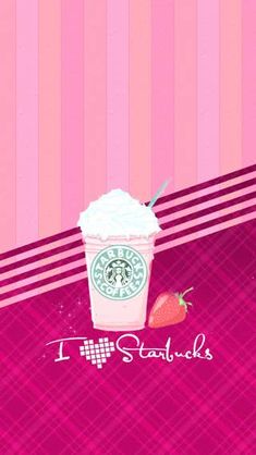 a starbucks drink with whipped cream and strawberries on the table next to pink striped wallpaper