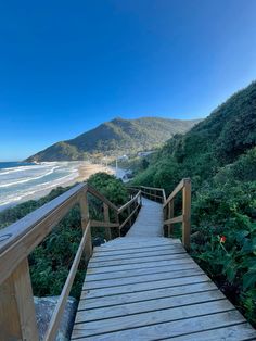 a wooden walkway going up to the beach