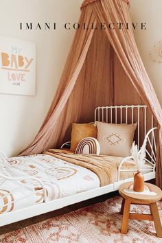 a bed with a canopy over it and pillows on the bottom floor in a bedroom